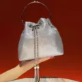 Sparkling silver bucket bag with metal ring handle and chain tassels for evening events - Silver