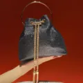 Sparkling black bucket evening bag with gold metal round handle and chain strap. - Black