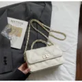White quilted chain shoulder bag for women, stylish crossbody handbag with metal lock. - No Pendant / Off White