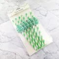 Close-up of green and white striped paper straws with tropical monstera leaf card decor. - Dark Green Stripe With Monstera Leaf Card
