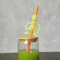 Halloween glowing skeleton straw detail view, creative party drink accessory, spooky cute style. - 4 Pcs Green Skull Orange Straw
