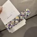 Détail de pince à cheveux en strass étincelant, barrette latérale élégante pour coiffure chic. - Blanc