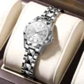 Women's silver quartz watch with diamond-cut geometric bezel and calendar display. - Silver White Dial
