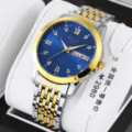 Detail view of two-tone quartz men watch featuring blue dial, rhinestone markers, and steel band. - 9-Bead Steel Band Style / Two-Tone Gold Blue Face