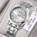 Silver stainless steel quartz men's watch with Roman numerals and calendar display. - Silver White Dial