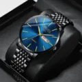 Close-up detail of the luxury men's quartz watch with blue dial and black steel bracelet. - Gentleman Black Mesh Band Blue Dial