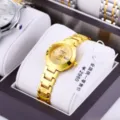 Goldene Damen Quarz Armbanduhr mit edlem Metallarmband, Zifferblatt und Datumsanzeige. - Leida Gold Gold Damen