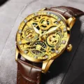 Luxury skeleton gold watch for men with brown leather strap and crystal dial details. - Brown Leather Strap Gear Gold Case Gold Dial