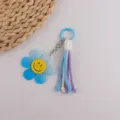 Llavero de flor estilo ins con colgante de flor de resina azul y borla de algodón para bolsos. - Azul