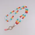 Kleurrijke acryl kraal lanyard met gouden sluiting en roze kwastje voor id badge telefoon - Regenboog