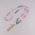 Acryl kraal sleutelhanger lanyard riem in roze zwart wit met schattige kwastje variant. - Roze Serie