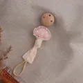 Cute forest style mushroom baby pacifier clip with wooden fastener and pink polka dot fabric. - Pink