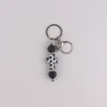 Black and white silicone cross keychain bag charm with metal rings and rhinestones for daily use. - Black