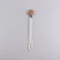 Handcrafted braided cotton baby pacifier chain with cute wooden flower clip for infants. - Milk White