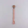 Handmade woven baby pacifier clip with wooden flower button and pink cotton strap for kids. - Rose Red