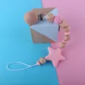Silicone star wooden bead baby pacifier clip and teething chain product detail view. - Pink