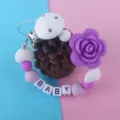 Attache tétine en silicone avec perles de fleurs et lettres pour la sécurité de bébé. - Violet