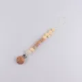 Baby pacifier clip wooden silicone teether toy with cute bow and letters for newborns. - Beige Crochet Ball