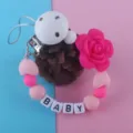 Attache tetine bebe en silicone anneau de dentition avec perles et fleur rose elegante. - Rose rouge