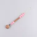 Pink silicone pacifier clip baby teething toy with wooden beads and custom design secure strap. - Pink Yarn Ball