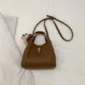 Bruine lederen emmertas casual schoudertas crossbody tas met handvat bovenop stijl - Met Hanger / Bruin
