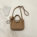 Brown PU leather shoulder bag with cute bear pendant, retro crossbody tote for women daily commute. - Khaki With Pendant