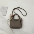 Women stylish commuter shoulder bag retro casual crossbody bag with cute charm and lock design. - Gray With Pendant
