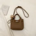Brown leather crossbody bag with cute bear charm, elegant vintage commuter shoulder bag for women - Brown with Pendant