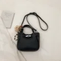 Black leather crossbody bag for women, retro commuter shoulder tote with metal lock and charm. - Black With Pendant