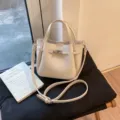White PU leather shoulder bag for women, chic commuter crossbody bag with lock detail. - White Without Pendant