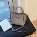 Grey leather commuter handbag with metal turn lock and shoulder strap for women daily use. - Gray without Pendant