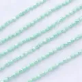 Κοντινό πλάνο από χάντρες κρυστάλλου 4mm σε ανοιχτό πράσινο για DIY κοσμήματα και χειροτεχνία. - Πορσελάνινο Μέντα AB (Περίπου 100 Τεμάχια)