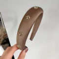 Brown wide padded headband with metallic cross rivets stylish hair accessory for women - Round / Brown