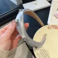 Serre-tête rembourré argenté avec détails de breloques en cristal métallique, accessoire tendance. - Gris
