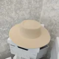 Detailed close up of the elegant beige flat top felt hat with a wide brim for autumn fashion. - M (56-58cm) / Beige