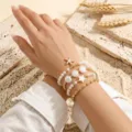 Detailed shot of multi-layer summer beach pearl starfish and shell bracelet set, elegant. - Euro Starfish Shell Pearl Layered Style (ZJ16989)