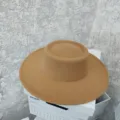 Close-up detail of a classic camel flat-top wide-brim felt hat, retro autumn winter style. - M (56-58cm) / Camel
