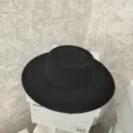Black flat top wool felt hat detail, wide brim vintage winter hat close up view - M (56-58cm) / Black