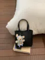 Women stylish black leather bucket bag with cute bear pendant, commuter crossbody bag. - Black With Pendant
