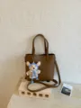 Brown leather shoulder bucket bag with cute crochet bear pendant, casual daily commute handbag. - Brown With Pendant