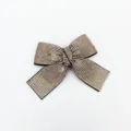 Sparkling rhinestone bow hair clip detail close-up, elegant crystal hairpin for women and girls. - Long Tail Bow Spring Clip / Champagne