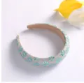 Detailed view of luxury rhinestone crystal sunflower headband, sparkly hair accessory - Aquamarine
