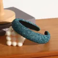 Detailed view of the dark teal textured headband with crystal drops, ideal for styling. - Lake Blue