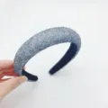 Close-up view of the sparkling crystal textured wide headband detail and surface. - Gray