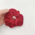 Close-up detail of red velvet hair scrunchie adorned with sparkling rhinestones, soft fabric. - Scrunchie / China Red
