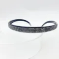 Detailed close-up of a stylish black rhinestone headband showing sparkling crystal details. - Mineral Grey