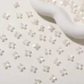 Mini jelly flower acrylic charms detail view, glossy four petal DIY jewelry accessories part. - Beige