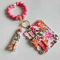 Roze siliconen kralen polsband sleutelhanger met bloemen PU leer houder en kwast. - Dieproze