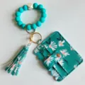 Bloemen PU houder siliconen kralen armband sleutelhanger met kwastje voor dames stijlvol - Pauwenblauw