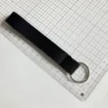 Black wrist strap keychain lanyard, durable fabric design with metal ring for daily use. - Solid Black